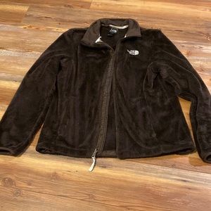 Brown fuzzy North Face jacket.  Women’s size M. Good preowned condition.
